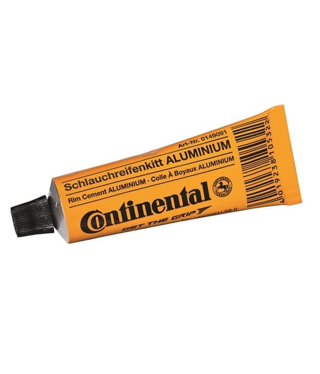 Continental-Tublim-aluminium.jpg En gul tub märkt "Continental Schlauchreifenkit ALUMINIUM" med svart lock