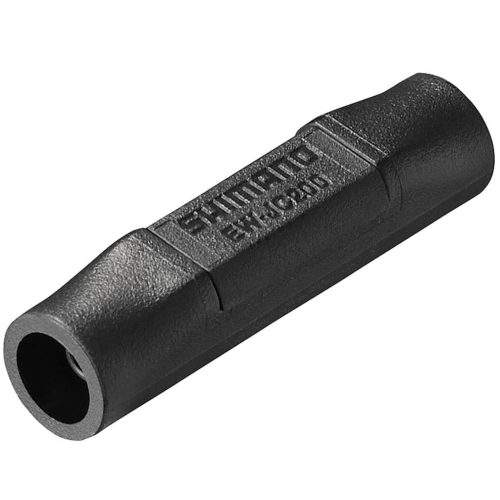 En svart, cylindrisk kabelkontakt med lätt räfflad yta, märkt "SHIMANO" längs toppen och öppningar i båda ändar.