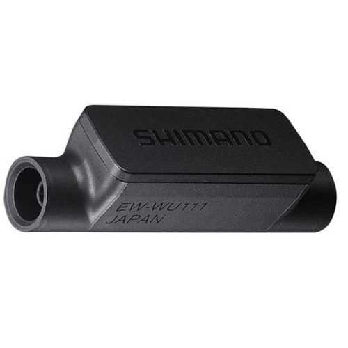 En svart Shimano Trådlössändare EW-WU111 Di2 D-fly, ANT+, med rektangulär kropp, rundade kanter och en port i ena änden, märkt "EW-WU111 JAPAN".