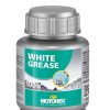 En silverfärgad 100-gramsbehållare med Motorex White Grease med en grönvit etikett med varumärkeslogotyp, produktnamn och en bild av fett som appliceras på en metalldel.