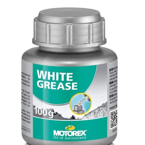 En silverfärgad 100-gramsbehållare med Motorex White Grease med en grönvit etikett med varumärkeslogotyp, produktnamn och en bild av fett som appliceras på en metalldel.