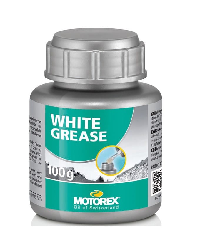 Motorex-whitegrease-100.jpg En silverfärgad 100-gramsbehållare med Motorex White Grease med en grönvit etikett med varumärkeslogotyp, produktnamn och en bild av fett som appliceras på en metalldel.