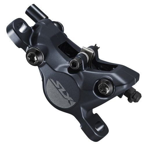 Närbild av ett Shimano SLX hydrauliskt skivbromsok för cyklar, med metallkropp, två monteringsbultar och slanganslutningsport.