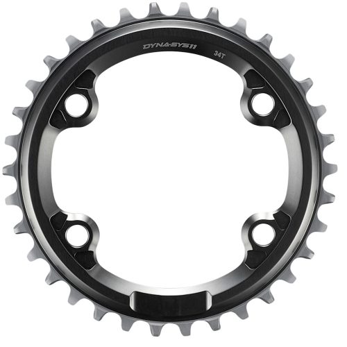 Närbild av en svart och silverfärgad cykelkedja med 34 tänder och fyra monteringshål, sedd uppifrån mot en vit bakgrund.