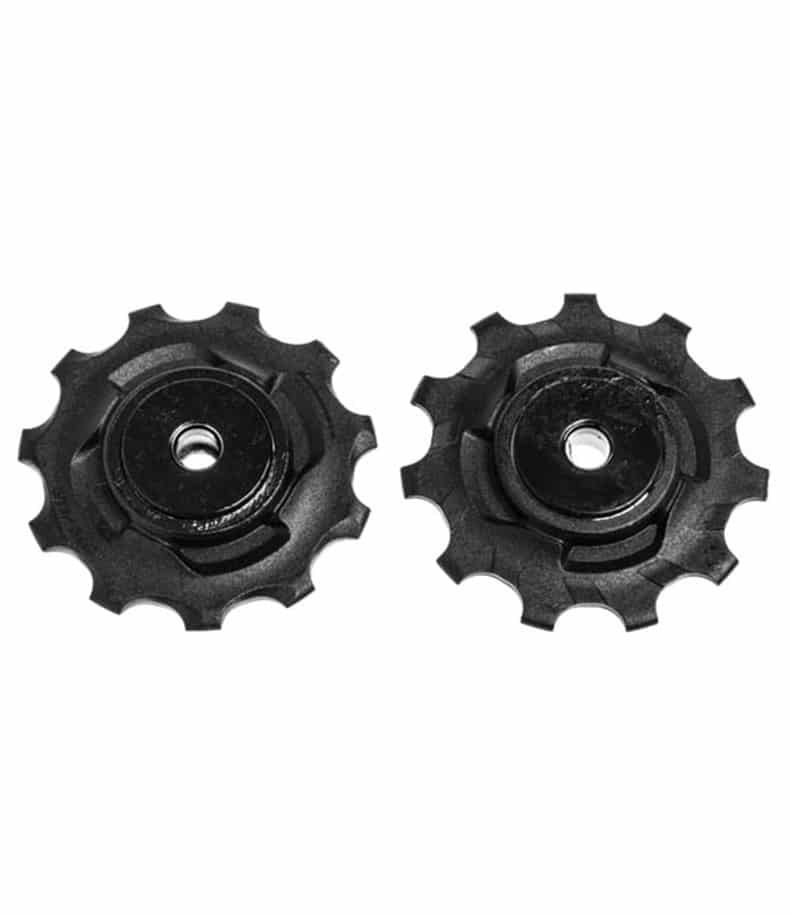 SRAM-Pulley-wheels-X0-Type2-Standardbearings.jpg Två svarta cykelväxelhjul av plast med centrala hål visas sida vid sida mot en vit bakgrund. Varje hjul har 11 tänder och en lätt tandad kant.