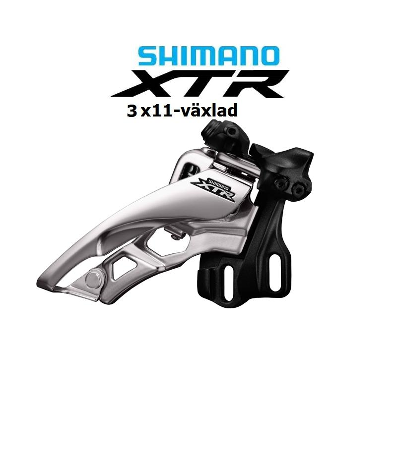 Shimano-XTR-3x11-M9000-front-pull-side-swing.png En Shimano XTR framväxel för en cykel med 3x11 växlar, mot en vit bakgrund med texten "SHIMANO XTR 3x11-växlad" ovanför komponenten.