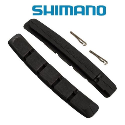 Ett par svarta Shimano-bromsbelägg med två små metallstift