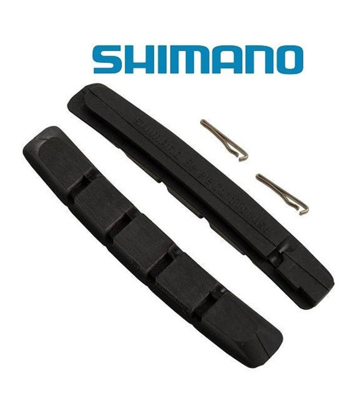 Shimano-XTR-XT-utbytes-Bromsbelagg-M70R2-Marathon.jpg Ett par svarta Shimano-bromsbelägg med två små metallstift