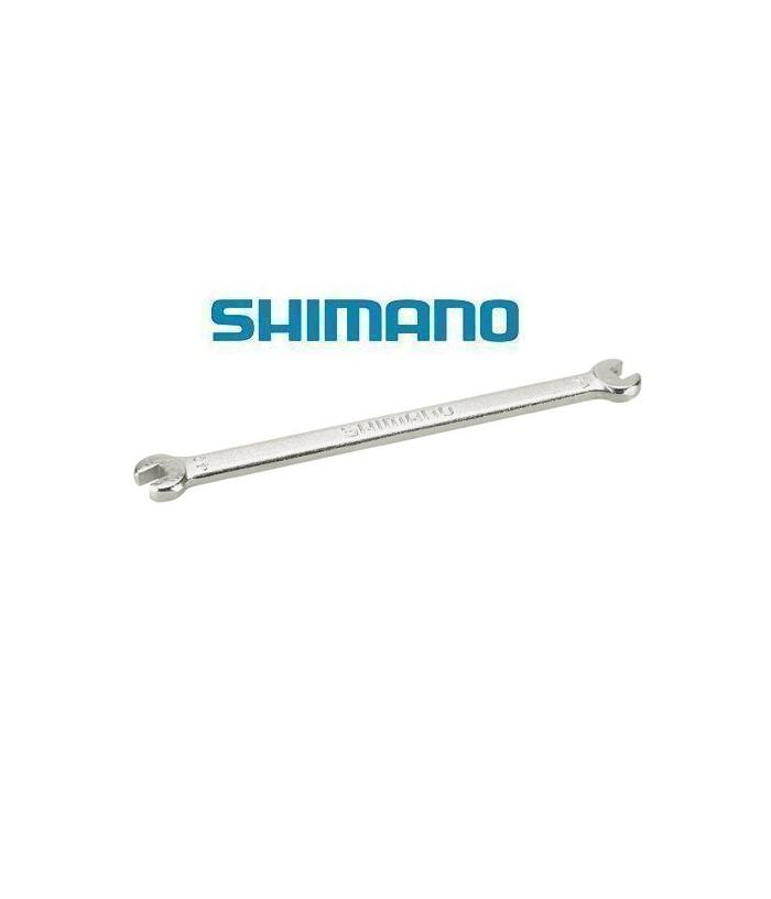 Shimano-ekernyckel.png En metallisk dubbeländad öppen skiftnyckel är avbildad under den blå Shimano-logotypen på en vit bakgrund. Skiftnyckeln ser ut att vara ett cykelverktyg.