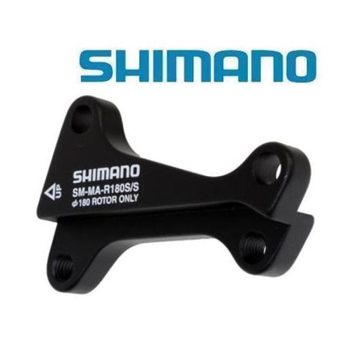 En svart Shimano SM-MA-R180S/S bromsadapter visas mot en vit bakgrund med den blå Shimano-logotypen ovanför. Adaptern har modellinformation och monteringsdetaljer tryckta med vita bokstäver.