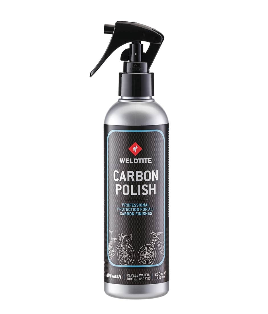 WELDTITE-Carbon-Polish-250ml.jpg En silverfärgad sprayflaska märkt "Weldtite Carbon Polish" med ett svart avtryckarmunstycke, som visar bilder på cyklar och anger att den är avsedd för professionellt skydd av alla kolfiberytor. Flaskan innehåller 250 ml.
