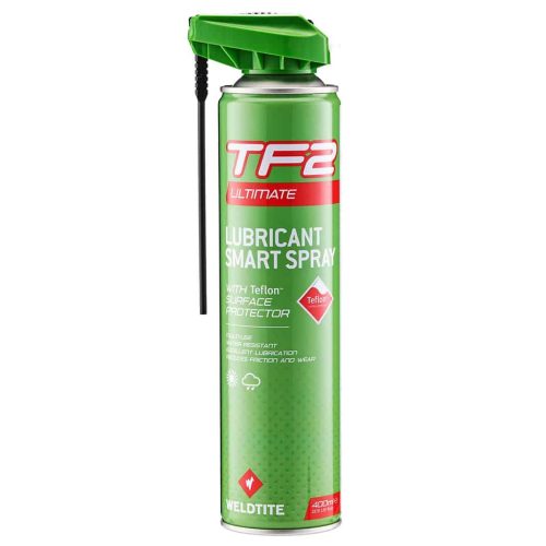 En burk TF2 Ultimate Lubricant Smart Spray med grönt lock och påsatt sugrör, med röd och vit märkning, utformad för att minska friktion och slitage; tillverkad av Weldtite.