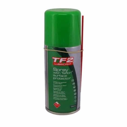 En burk TF2 Lubricant Spray med Teflon Surface Protector, med grönt lock och ett rött sugrör på sidan för precisionsapplicering. Produktetiketten är huvudsakligen grön med vit och röd text.