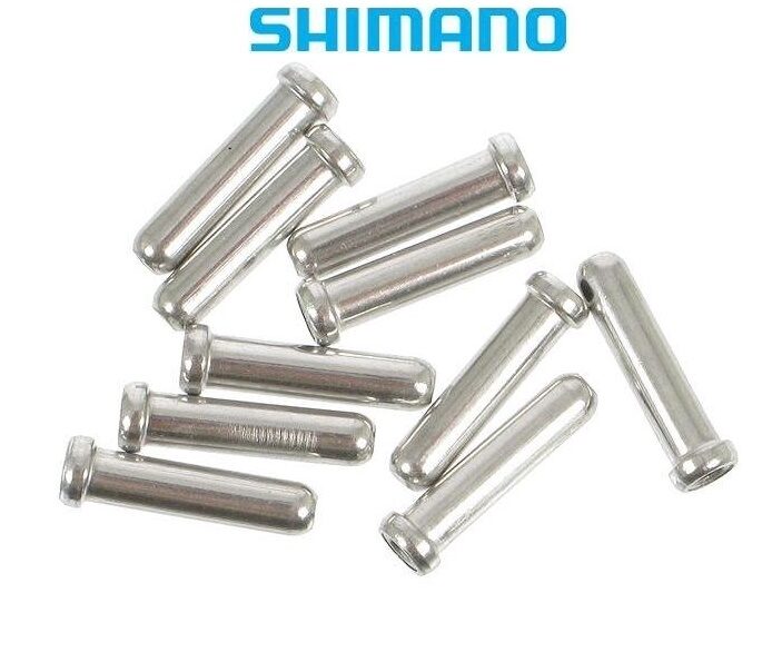 Y62098040_20150-e1639387579374.jpg Tio silverfärgade Shimano-kabeländstycken är utspridda på en vit bakgrund, med den blå Shimano-logotypen högst upp i bilden.