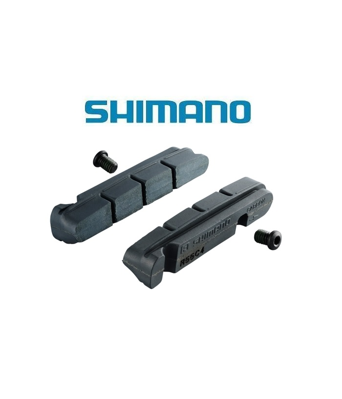 bromsbelagg-shimano-dura-ace-for-carbonfalg.png Två svarta Shimano-bromsbelägg för cyklar visas med två små skruvar mot en vit bakgrund. Den blå Shimano-logotypen visas ovanför bromsbeläggen.