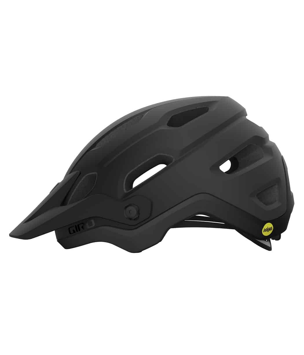 giro-source-mips-dirt-helmet-matte-black-fade-right.jpg En mattsvart cykelhjälm med visir, ventilationsöppningar på sidorna och en MIPS-säkerhetslogotyp nära ryggen. Hjälmen har en kantig, modern design och justerbara remmar.