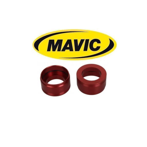 Två röda adapterringar i metall är placerade under en gul oval Mavic-logotyp med svarta bokstäver på en vit bakgrund.