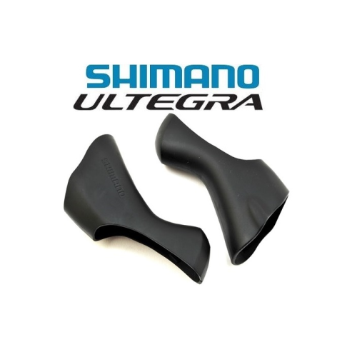 Två svarta Shimano Ultegra-bromshandtagshuvuden visas sida vid sida på en vit bakgrund, med Shimano Ultegra-logotypen ovanför dem.