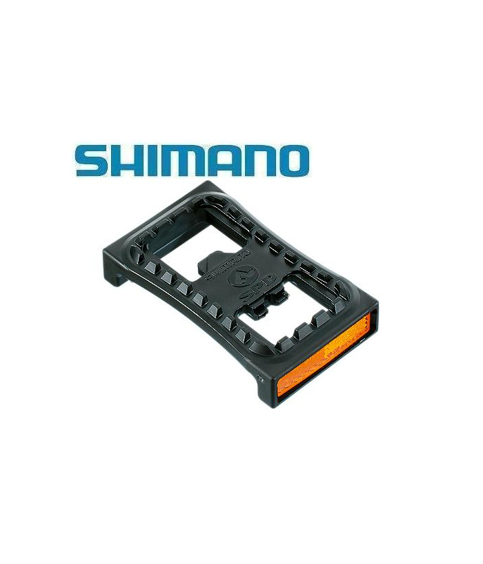shimano-refelxplatta-1.png En svart Shimano-cykelpedal med integrerade reflexer visas mot en vit bakgrund, med den blå Shimano-logotypen ovanför.