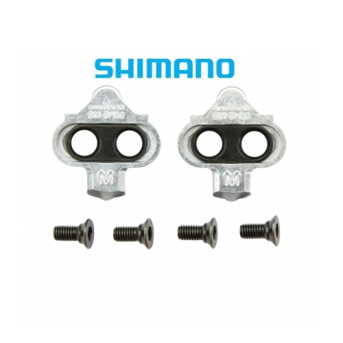 Två Shimano SM-SH56 cykelklämmor med fyra skruvar placerade under dem, på en vit bakgrund med Shimano-logotypen ovanför.