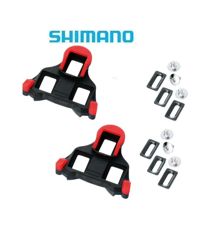 shimano-spd-sh10-lvg.png Två Shimano SPD-SL röd-svarta klossar för landsvägscyklar med tillbehör, inklusive skruvar och rektangulära brickor, visas på en vit bakgrund med Shimano-logotypen ovanför.