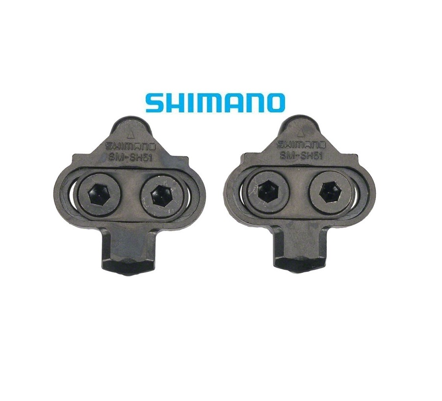 shimano-spd-sh51-utan-platta.png Två Shimano SM-SH51 cykelklossar med skruvar visas sida vid sida mot en vit bakgrund. Den blå Shimano-logotypen visas ovanför klossarna.