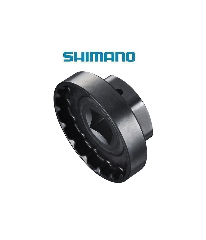 verktyg-shimano-tl-fc33-for-hollowtech-ii.png En svart Shimano cykelkomponentdel visas mot en vit bakgrund, med den blå Shimano-logotypen ovanför. Delen ser cylindrisk ut med en inre stjärnformad öppning.