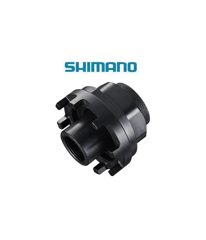 verktyg-shimano-tl-un96-for-vevlager.png Ett svart Shimano-cykelverktyg med flera skåror och en gängad mitt visas mot en vit bakgrund. Den blå Shimano-logotypen visas ovanför verktyget.