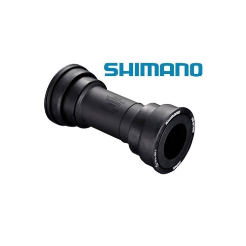 En svart Shimano cykeltretlagerdel visas mot en vit bakgrund, med den blå Shimano-logotypen ovanför. Komponenten ser ut att vara cylindrisk med räfflade ändar och vita textmarkeringar.