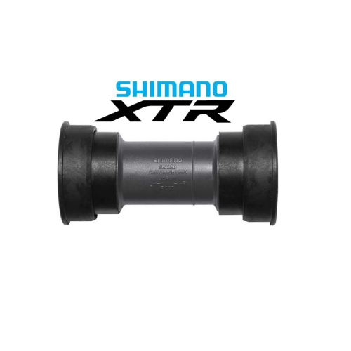 Ett Shimano XTR-cykeltretlager med svarta kopplingar i vardera änden