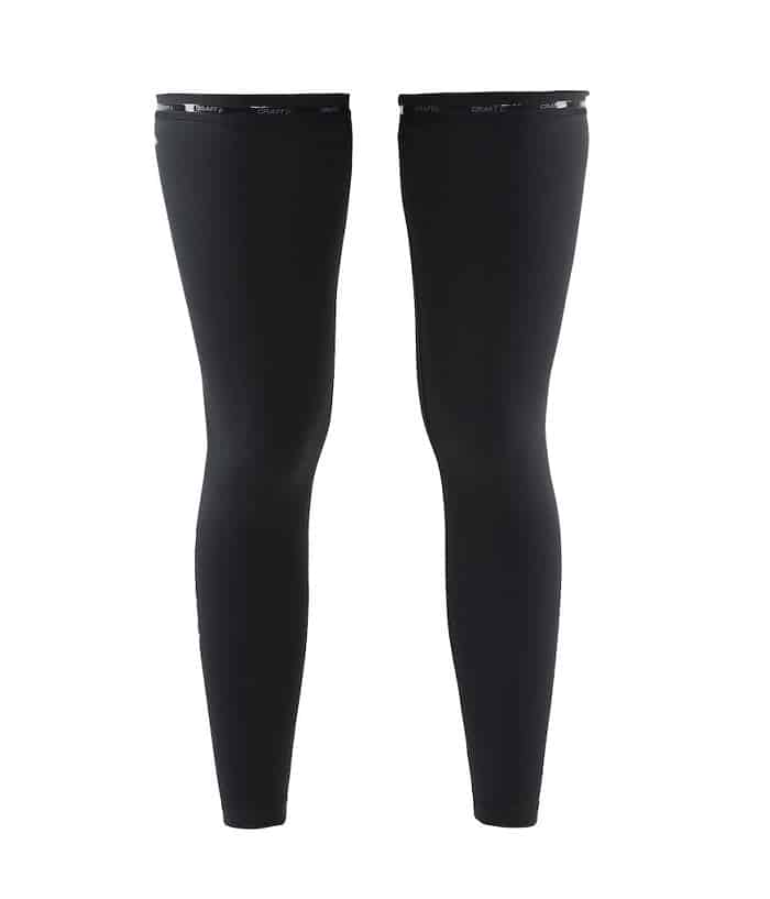 1904063_9999_Leg_Warmer_F_Preview.jpg Ett par Craft benvärmare, svarta hellånga atletiska benärmar med åtsittande passform och elastiska band upptill, visas sida vid sida mot en vit bakgrund.