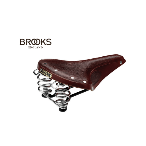 Brun Brooks B67 cykelsadel med kromade fjädrar och klassisk läderfinish. Bilden har en ren, studioliknande belysning som framhäver sadelns detaljer och textur.