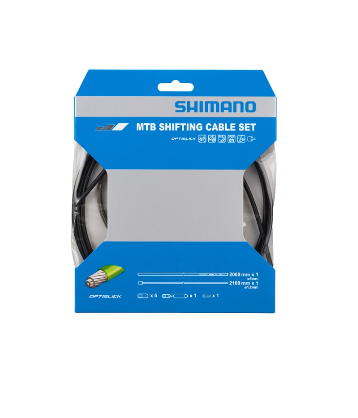 MTB-SHIFTING-CABLE-SET Produktbild av ett Shimano Optislick växelvajerset för mountainbike. Setet innehåller PTFE behandlat hölje, vajrar och tillbehör, förpackat i en blå och vit förpackning. Belysningen är jämn och detaljerna tydliga.