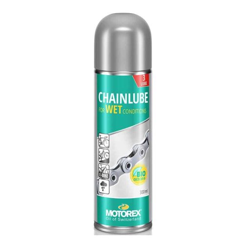 En flaska Motorex Wet Lube kedjeolja, avsedd för våta förhållanden. Silverfärgad behållare med grön etikett, med illustration av cykelkedja och symboler för e-bike och biologisk nedbrytbarhet. 300 ml.