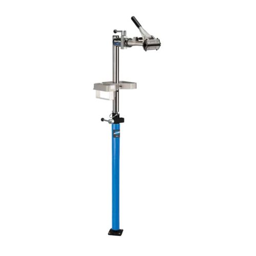 MekställPark Tool PRS-3.3 i verkstadsmiljö. Stativet är blått och silverfärgat med en justerbar klämma högst upp. Detaljerad bild med bra ljus och skärpa, perfekt för att visa funktioner.