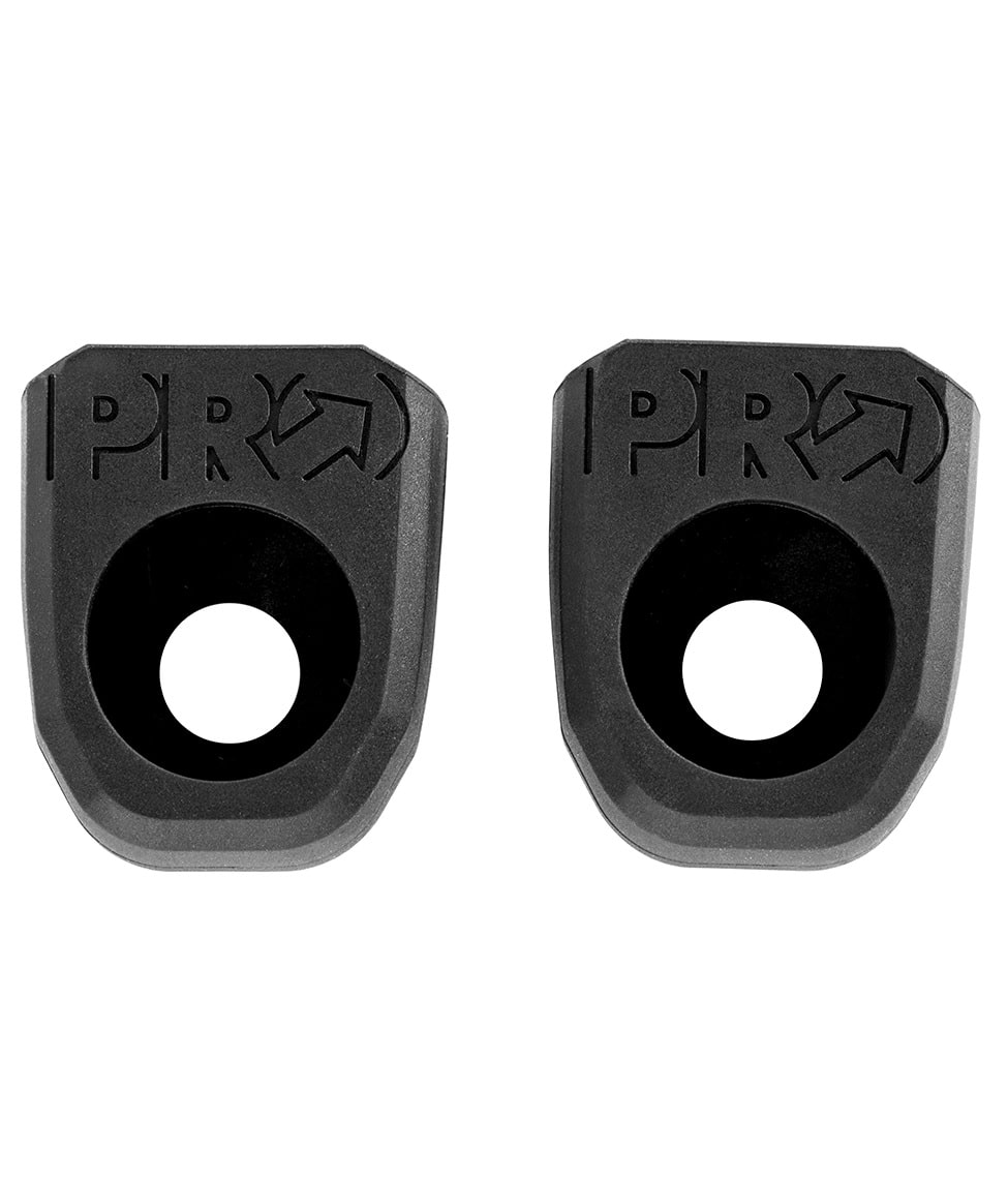Pro-Vevarmsskydd.jpg Närbild av två svarta Pro Crank Protectors på vit bakgrund. Skydden är av gummi med ett runt hål i mitten och "PRO" ingraverat upptill. Jämn belysning.