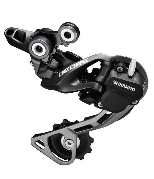 Shimano-Deore-RD-M615GSL.jpg Detaljerad bild av en Shimano Deore RD-M615 Shadow+ bakväxel för 10-växlade system, med mörkgrå och silverfärgade element. Skarpt fokus framhäver 'DEORE'-loggan och 'SHIMANO'-märket.