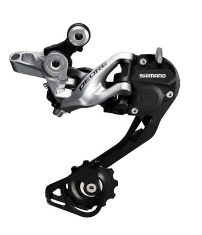 Detaljerad bild av en Shimano Deore RD-M615 Shadow+ bakväxel för 10-växlade system. Växeln har en silverfärgad arm och en svart mekanism, fångad i bra ljus.
