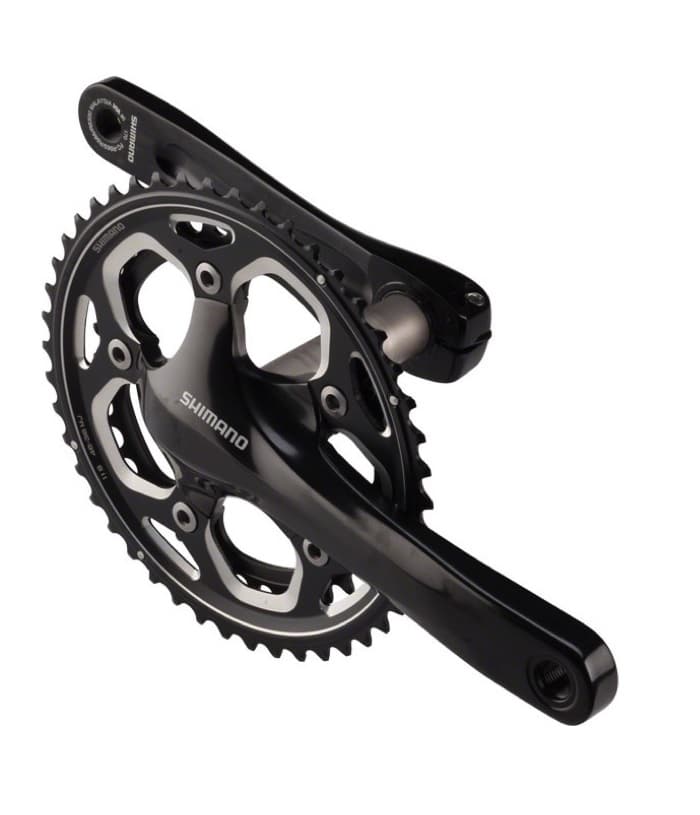 Shimano-FC-RS500.jpg Svart Shimano FC-RS500 vevparti i närbild mot en vit bakgrund. Kedjekransen har 46/36T, och är avsedd för 2x11-växlade system. Detaljrik och högkvalitativ produktfotografering.