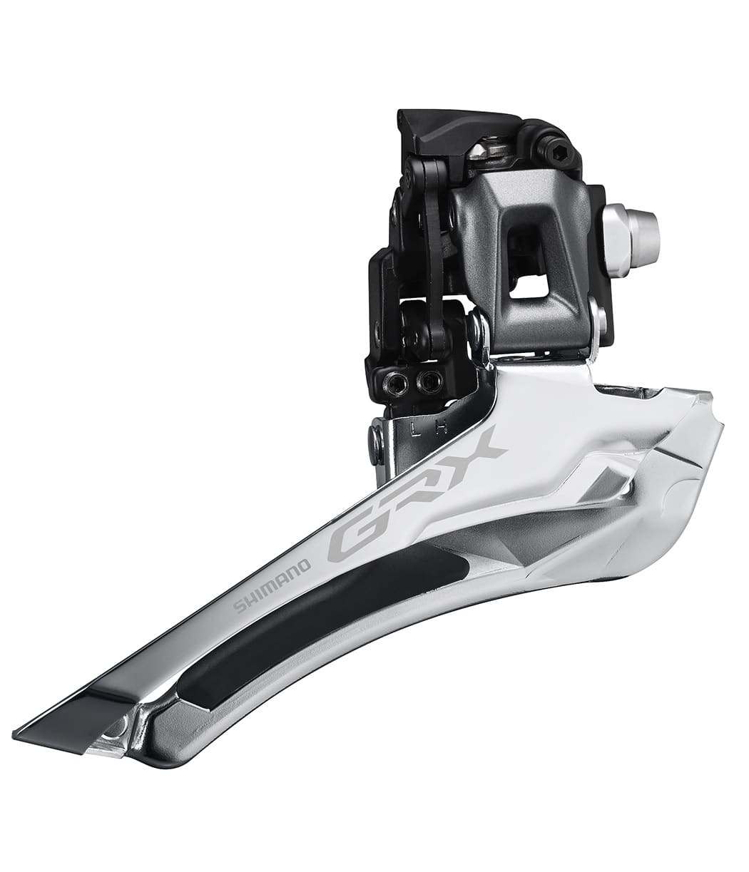 Shimano-GRX810-framvaxel.jpg Detaljerad bild av en Shimano GRX FD-RX810 framväxel, 2x11s, i silver och svart. Stark belysning framhäver de blanka ytorna och den precisa konstruktionen.