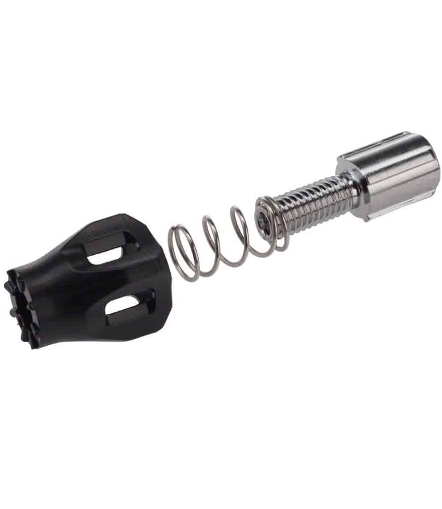 Shimano-RD-6800-Ultegra-justerskruv.jpg Detaljerad bild av en justerskruv för Shimano RD-6800 Ultegra bakväxel, med en svart plastände, en fjäder och en metallcylinder. Ljuset framhäver detaljerna i konstruktionen.