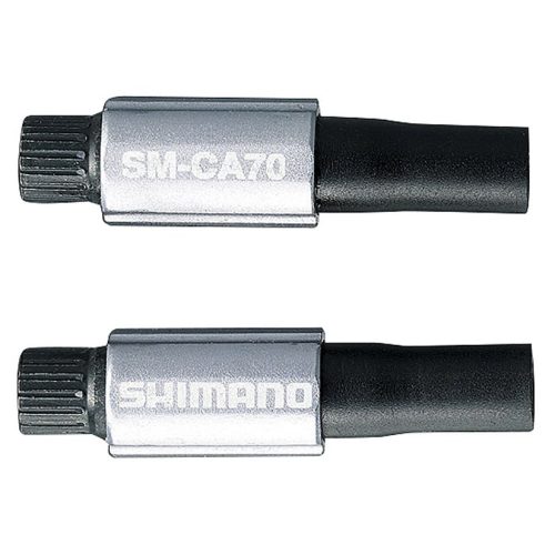 Två Shimano SM-CA70 justeringsverktyg för SP40/41 växelhöljen visas i detalj, med fokus på metalliska hylsor och de texturerade ändarna. Belysningen är stark och framhäver produkternas form och märken.