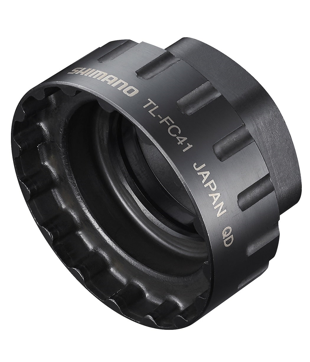 Shimano-TL-FC41-1.jpg Verktyg Shimano TL-FC41 för direktmontering av främre kedjedrev i svart metall. Starkt belyst med fokus på detaljerna i verktygets form och texten "SHIMANO TL-FC41 JAPAN QD".