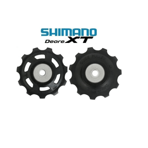 Svarta Shimano XT rulltrissor för RD-M773 10-växlade system visas i detalj under ljus belysning. Logotypen "Shimano Deore XT" syns tydligt ovanför