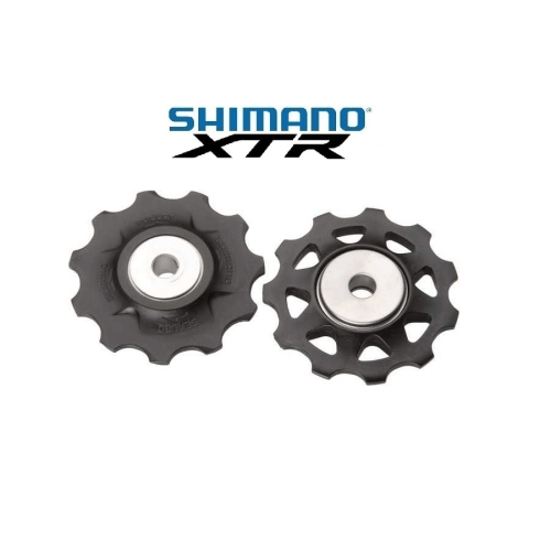 Två detaljerade Shimano RD-M970 XTR rulltrissor för 10-växlade system visas mot en ljus bakgrund under mjuk belysning