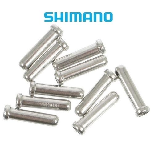 Närbild av Shimanos ändhylsor för innervajer, 1,6mm. Silverfärgade, metalliska och arrangerade på en vit bakgrund med en ljus och jämn belysning. Shimano-logotypen syns ovanför.