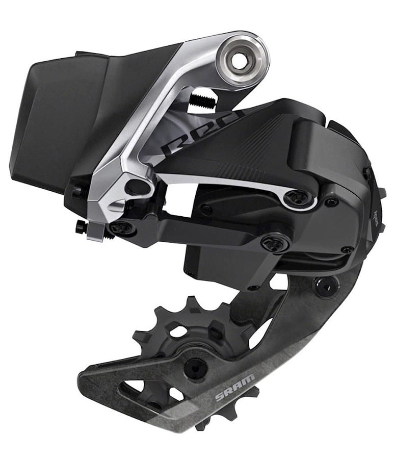 Sram-Red-Etap-AXS-12-vaxlad.jpg Detaljerad bild av en SRAM Red eTap AXS 12-växlad bakväxel, framhävd med stark belysning som betonar dess silverfärgade och svarta komponenter.
