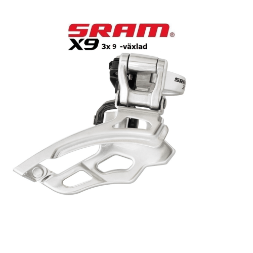 Silvrig framväxel Sram X9 med högklamma, avsedd för 3x9-växlad drivlina. Produkten presenteras i en studiobelysning mot en ren, vit bakgrund.