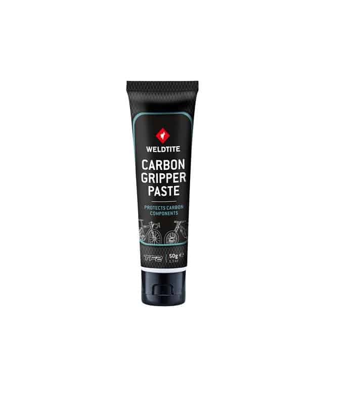 WELDTITE_Carbon_Gripper_Paste.jpg En tub Weldtite Carbon Gripper Paste, en monteringspasta för kolfiberkomponenter. Tuben är svart med blå detaljer och vit text. Bilden är tagen i bra ljus med vit bakgrund.