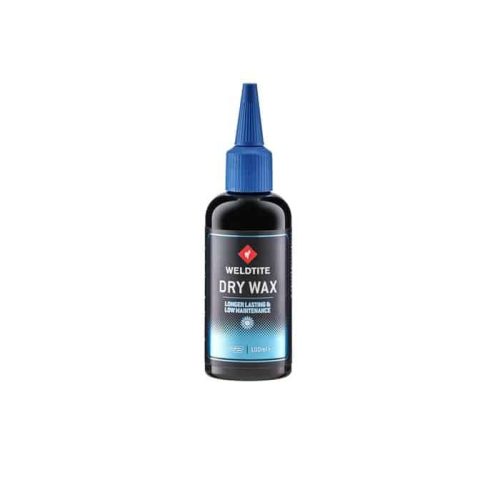En flaska Weldtite Dry Wax, ett kedjevax för cyklar, står i ett neutralt ljus. Flaskan är svart med en blå pip och etikett med texten "DRY WAX".